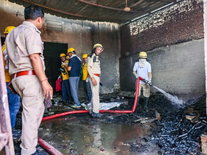 Police and rescue teams inspect the site after a fire at an alleged illegal firecracker warehouse in Jaipur that killed seven people.