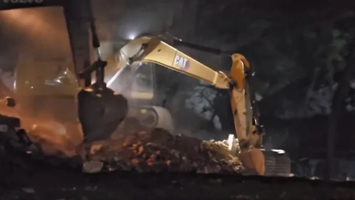 Ajgaib Shaheed Mosque demolition during a midnight operation in Varanasi with heavy police deployment.