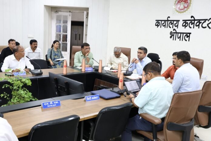 Bhopal Collector Priyank Mishra reviews key government projects and launches the DM Pragati Portal during the weekly review meeting.