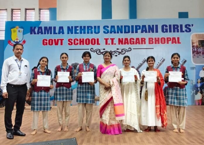 Bhopal school students receive student council election certificates.