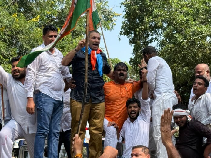 Congress protest Bhopal SIR: Party workers led by state president Jitu Patwari try to breach barricades near the Chief Electoral Officer's office on Monday.